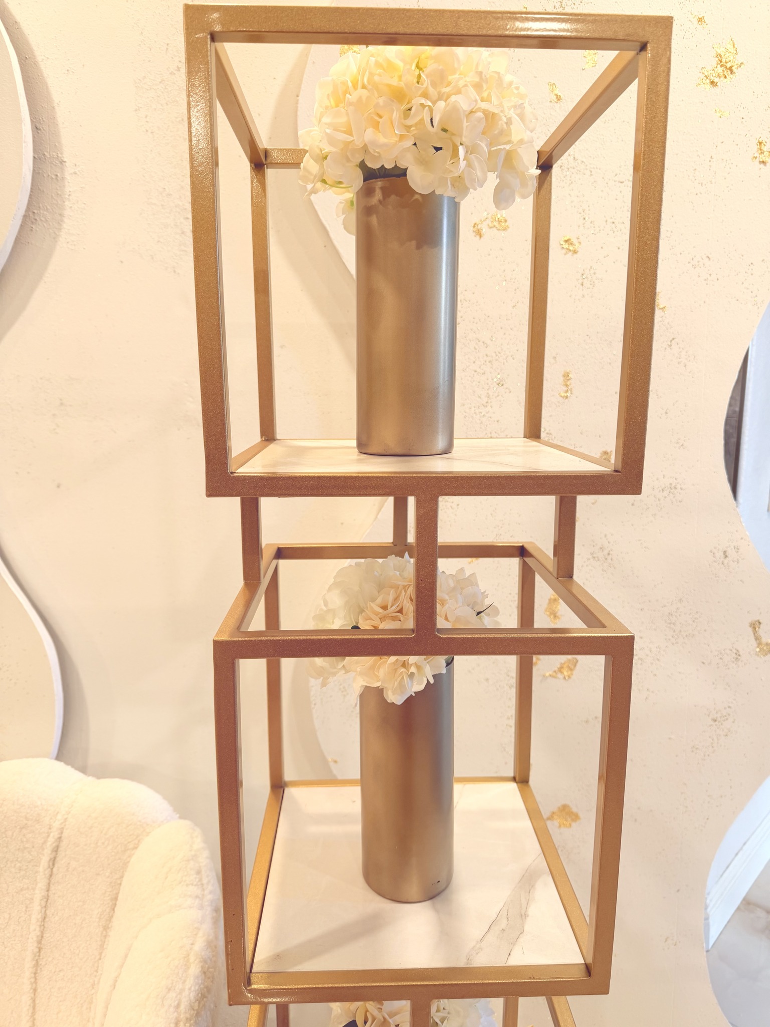 Gold cube shelving with florals