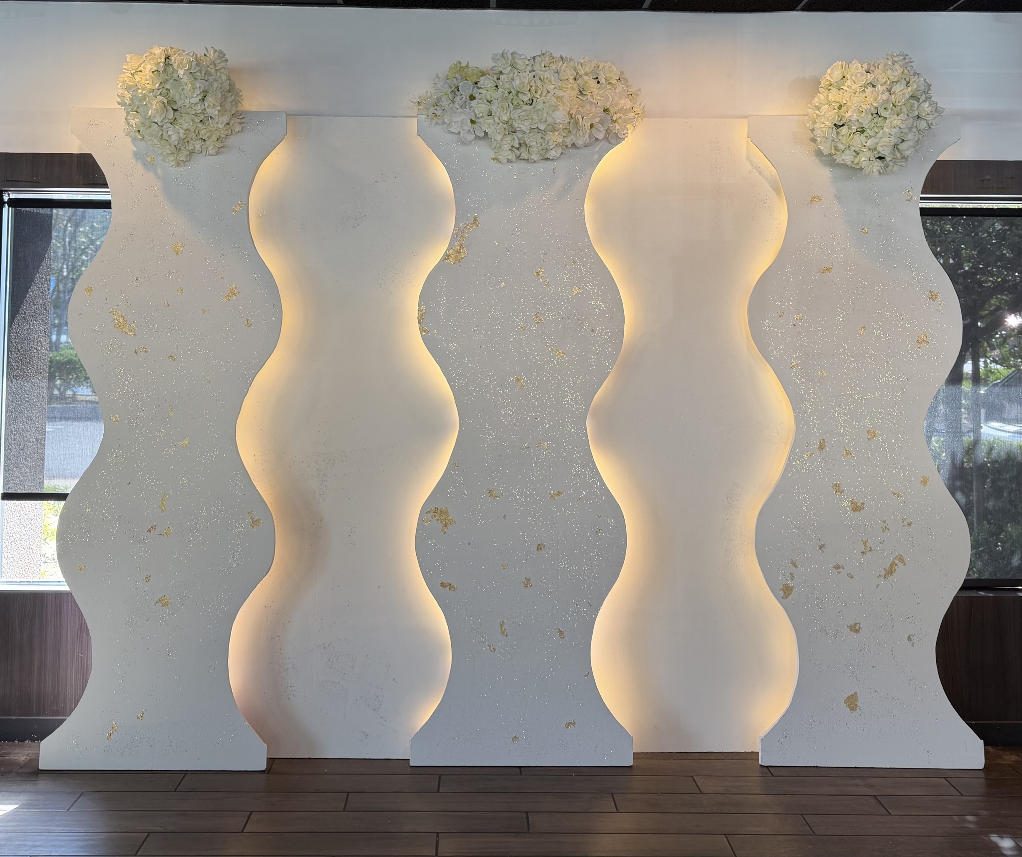 Venue backdrop installation with uplighting